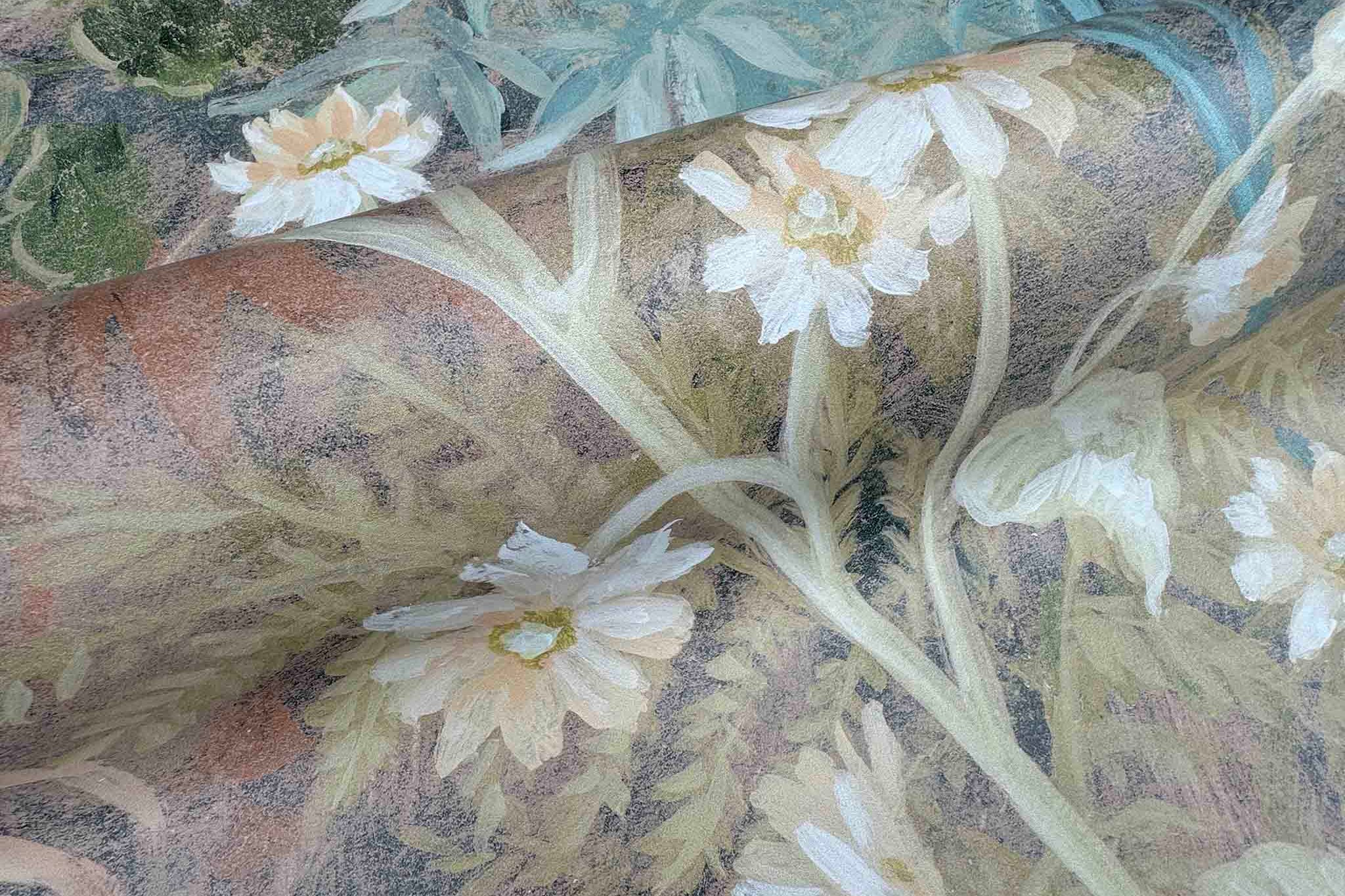 Close-up of a soft floral mural featuring white flowers and lush foliage, printed on durable Premier Vinyl.