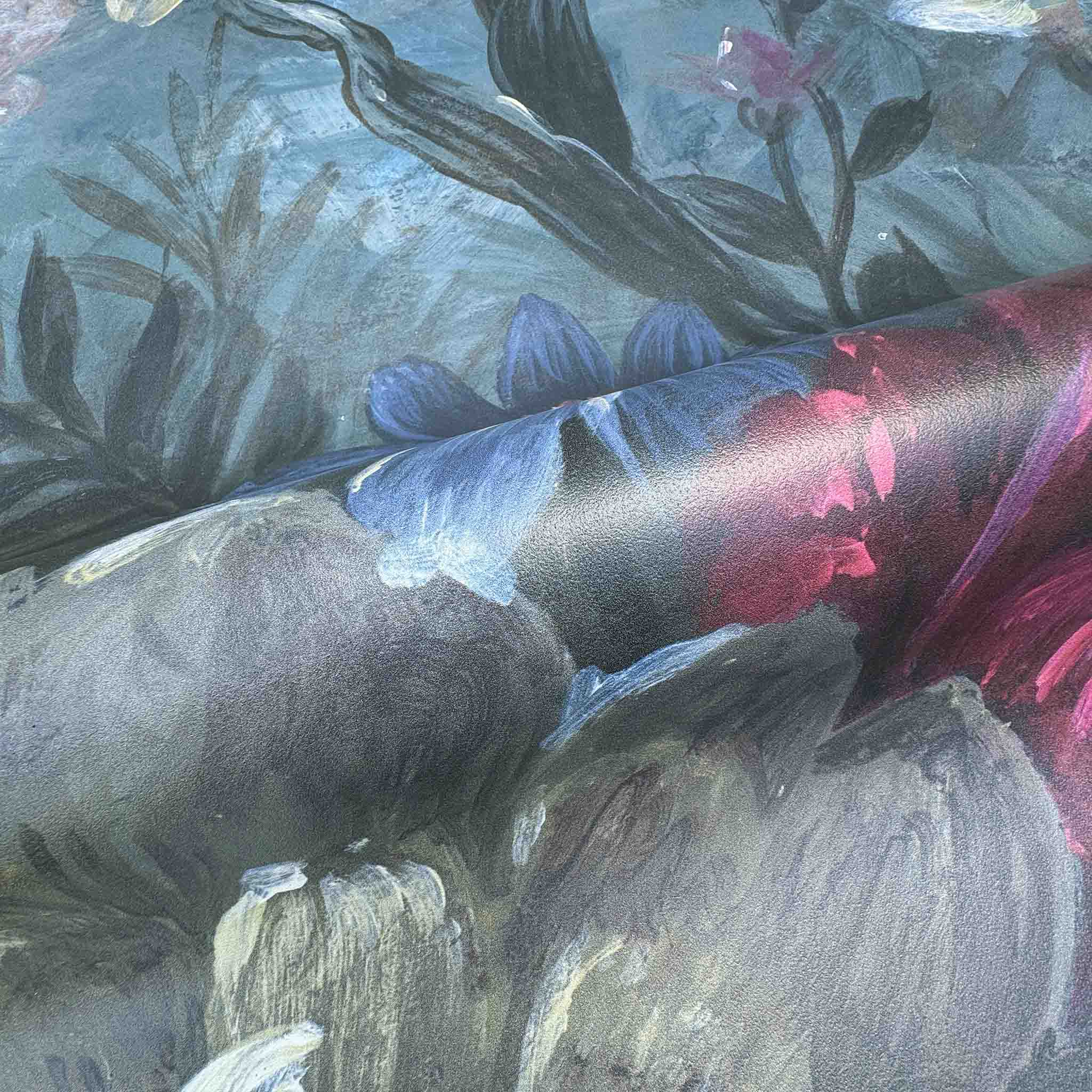 Close-up of a floral wallpaper mural featuring deep jewel tones and soft pastel accents on a durable vinyl substrate.