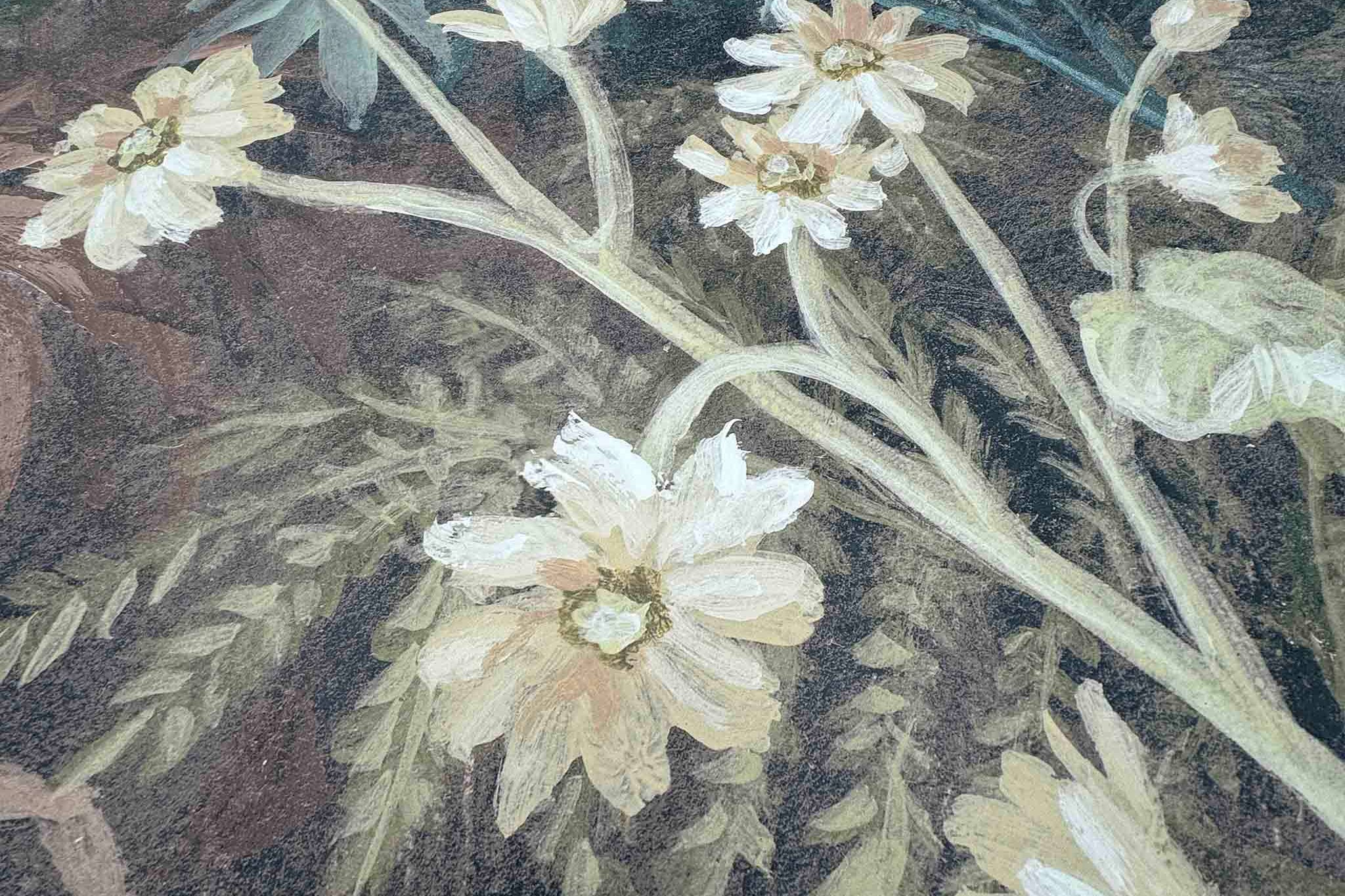 Close-up of a hand-painted floral mural featuring delicate white blooms and mossy greens on a matte uncoated substrate.