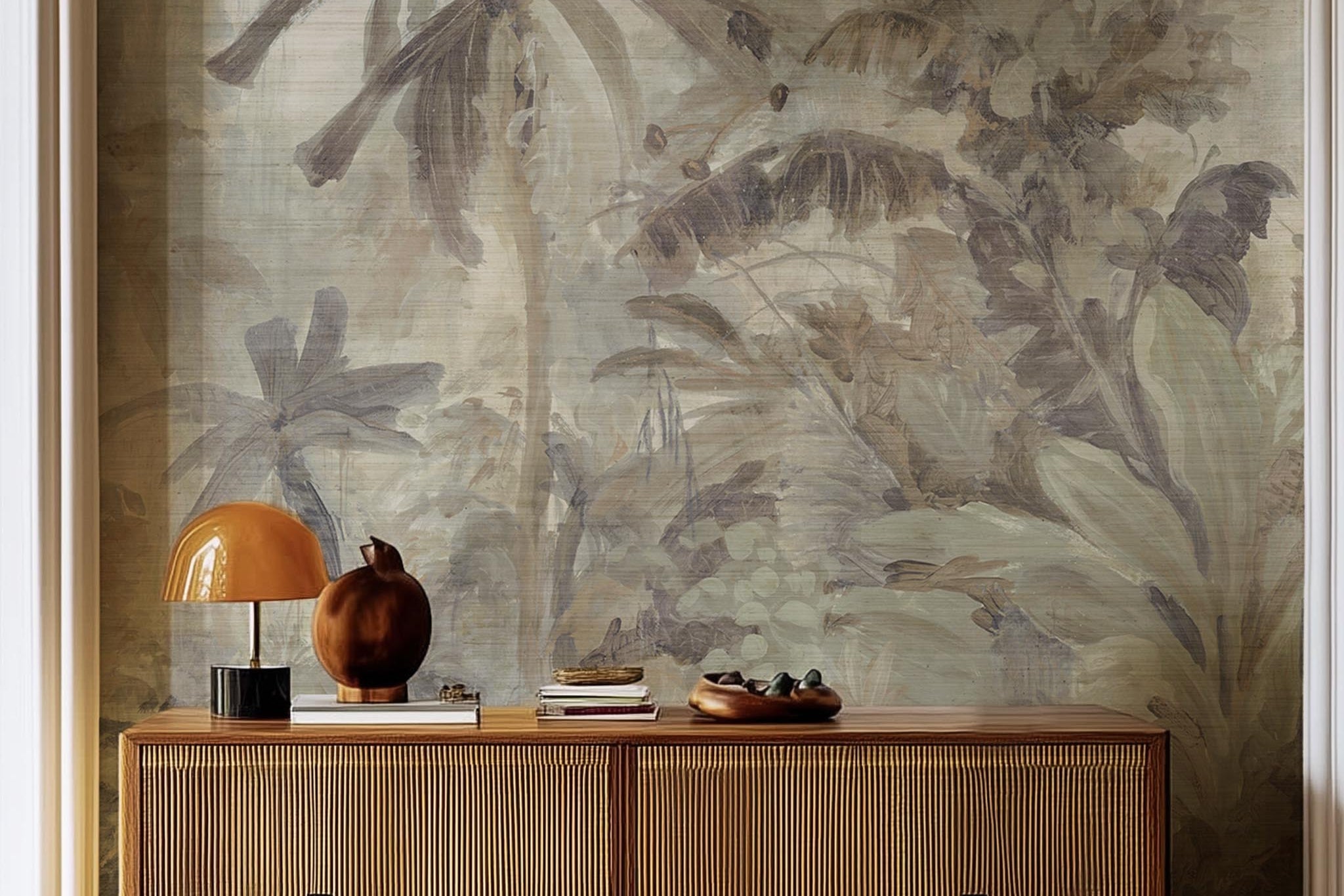 A cropped view of living room featuring a panoramic grasscloth wallpaper mural of a jungle scene in sepia and blue.