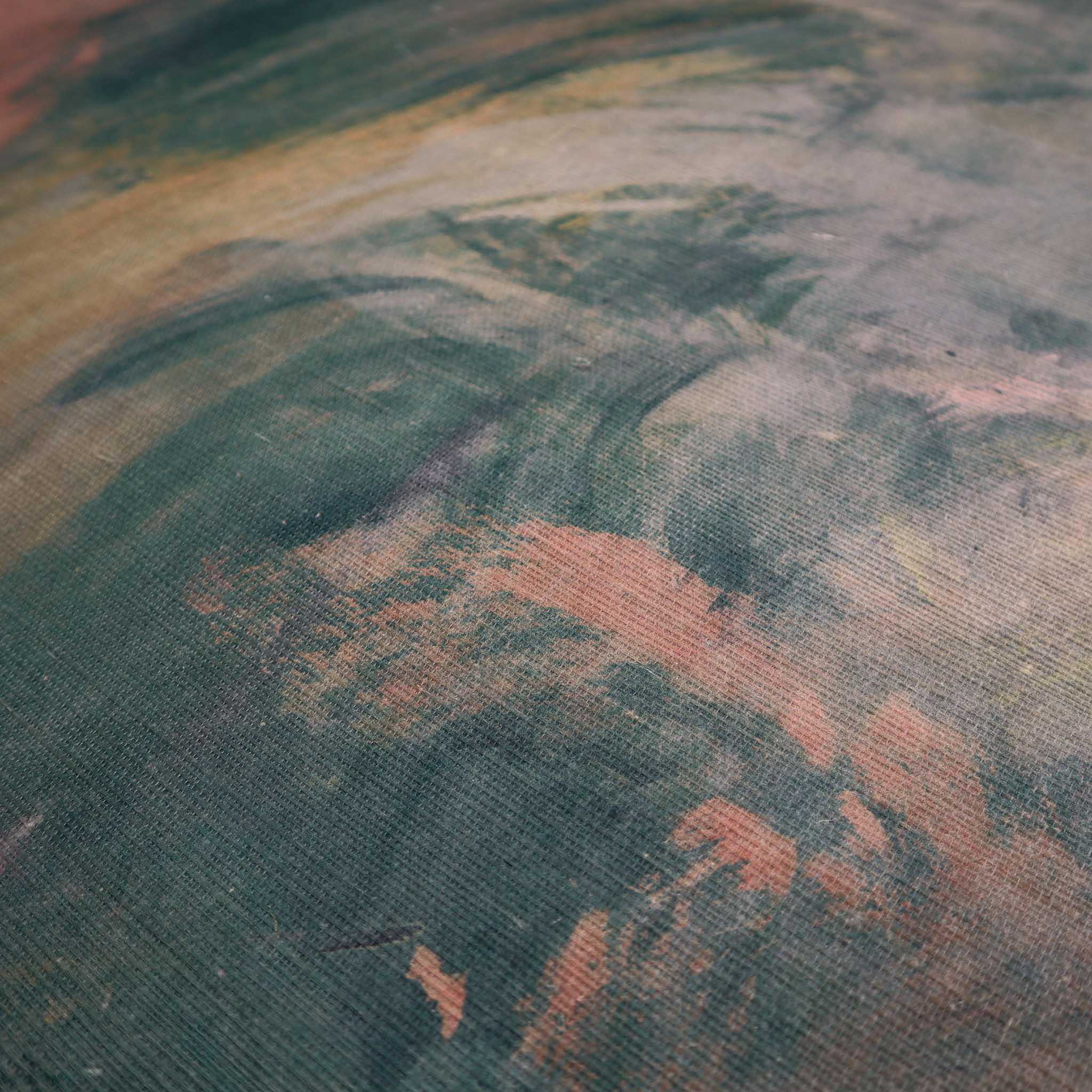 Close-up of a textured grasscloth wallpaper mural featuring abstract swirls in ember red, cream, and deep green tones.