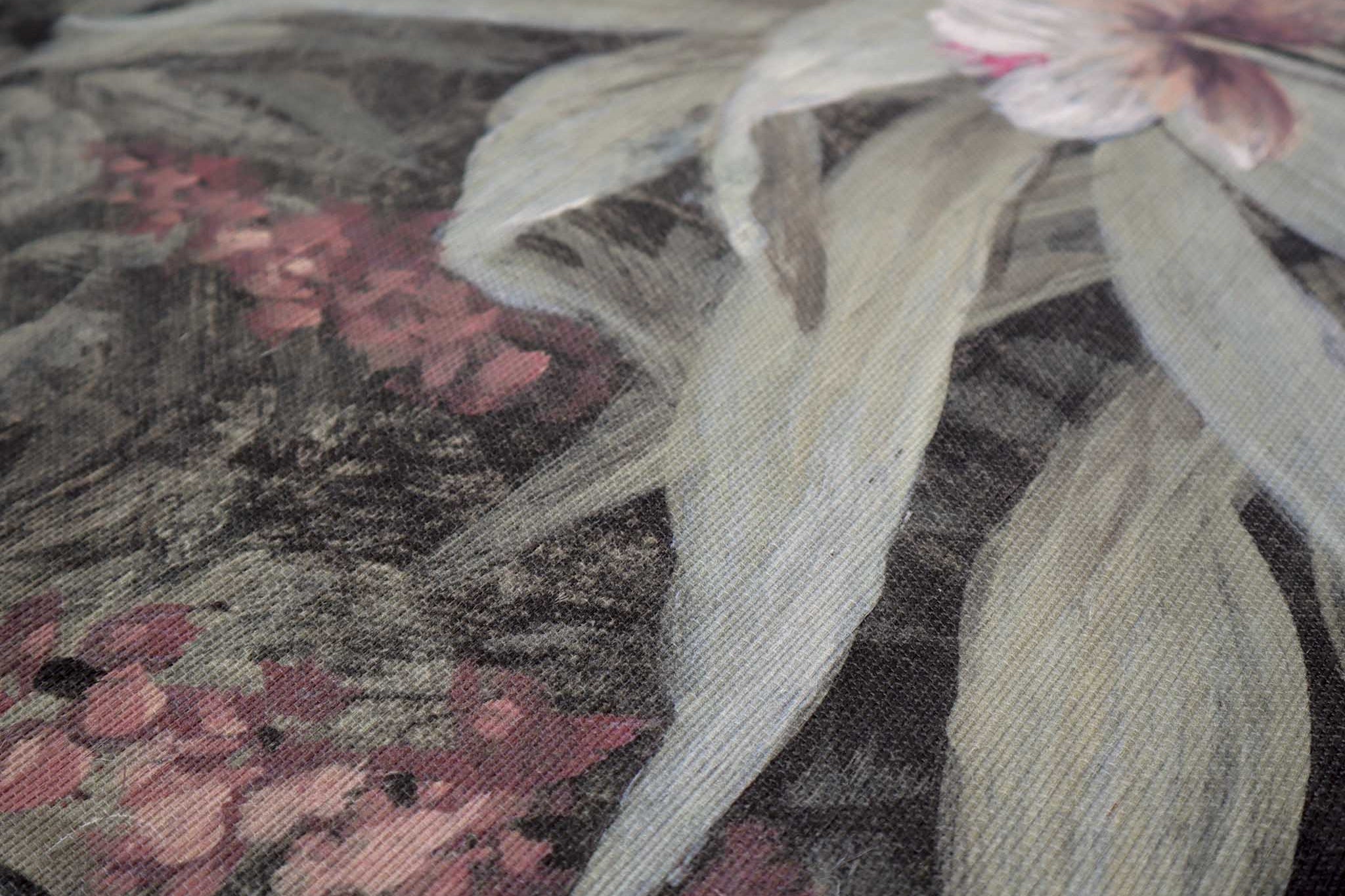 Close-up of a hand-painted floral mural on textured grasscloth, featuring pastel greens, pinks, and subtle purples.