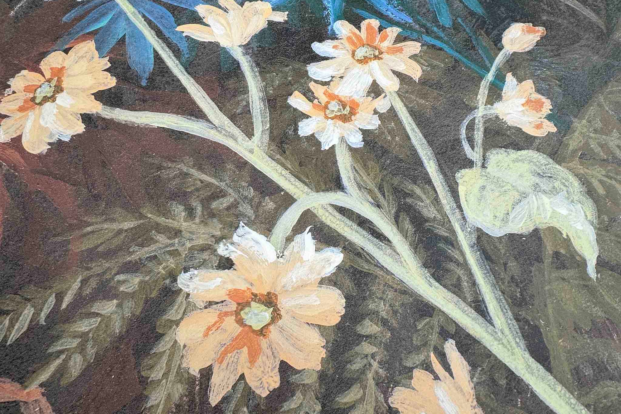 Close-up of a hand-painted floral wallpaper mural featuring pale yellow flowers against a dark green background.