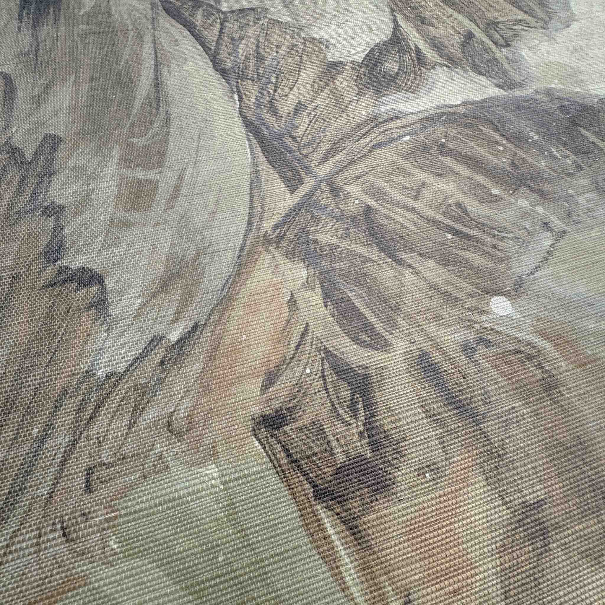 Close-up of a wallpaper mural with soft sandy hues and muted greens, featuring abstract tropical foliage on grasscloth.