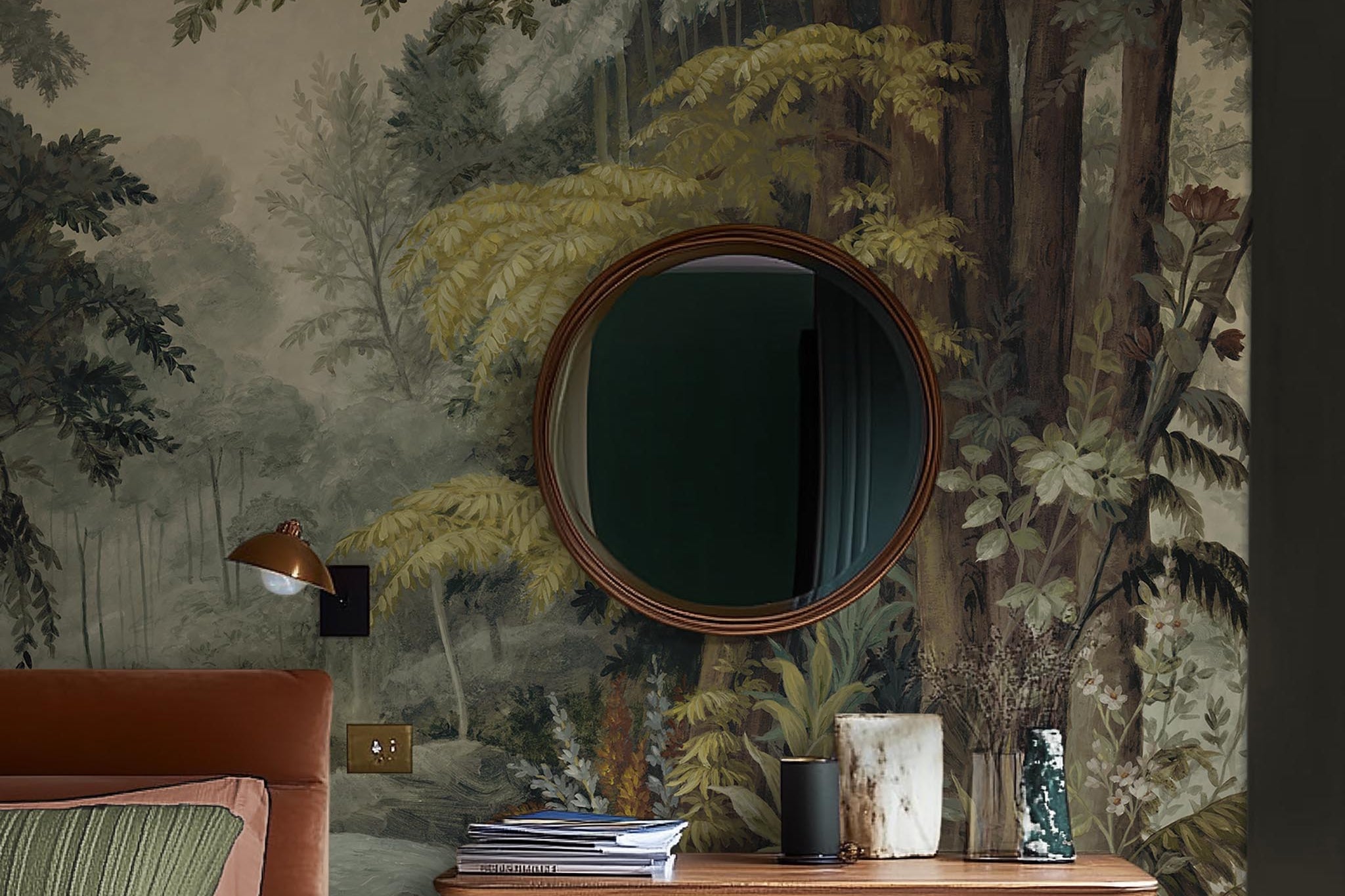 A cropped view of bedroom featuring a panoramic matte wallpaper mural of a misty woodland in sage and ochre.
