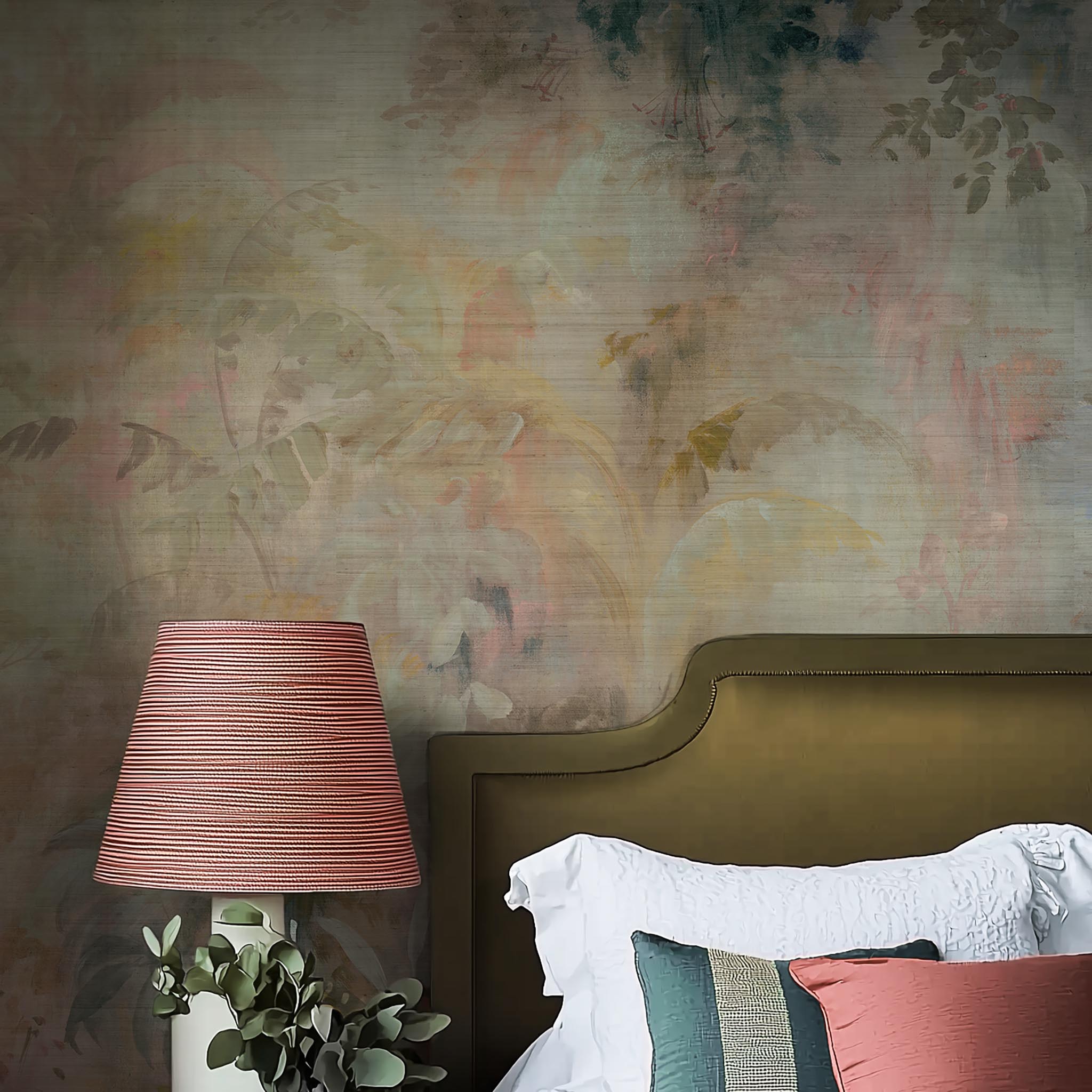 A cropped view of bedroom featuring a panoramic grasscloth wallpaper mural of a rainforest in blush and sky blue.