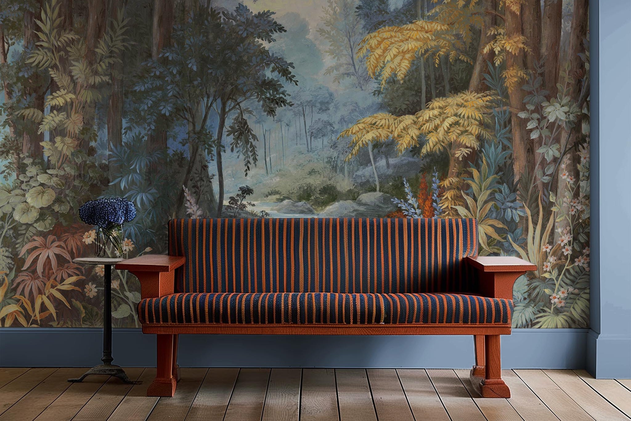An interior sitting area featuring a panoramic matte wallpaper mural of an enchanted forest in blue and rust.