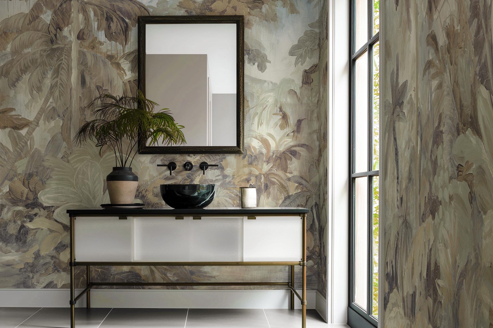 An interior bathroom featuring a panoramic vinyl wallpaper mural of a jungle scene in sepia and blue.