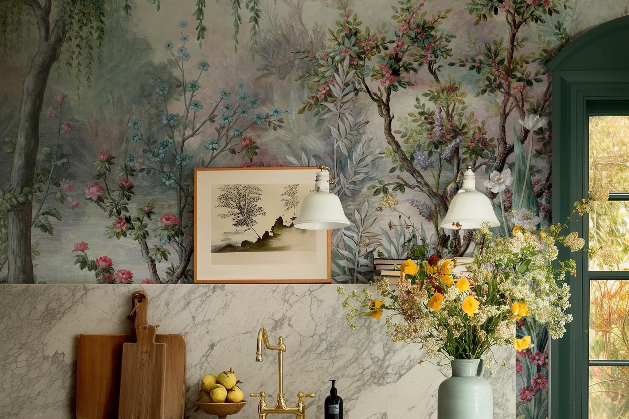 A cropped view of kitchen featuring a panoramic vinyl wallpaper mural of a lakeside garden scene in mint and pink.