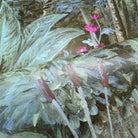 Close-up of a bespoke tropical mural featuring lush green foliage and vibrant pink flowers, printed on durable vinyl.
