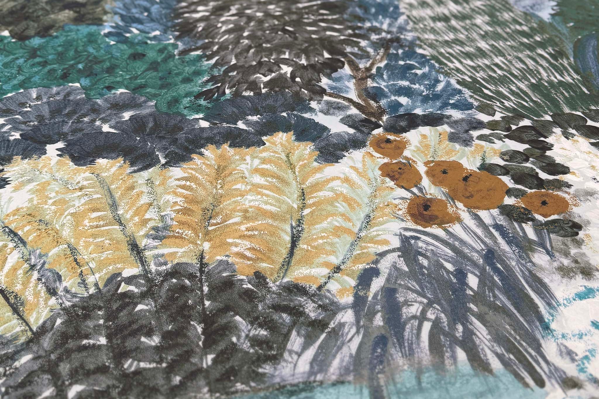 A close up view showing the detail of a matte wallpaper mural which features teal, sea green, and slate countryside scene