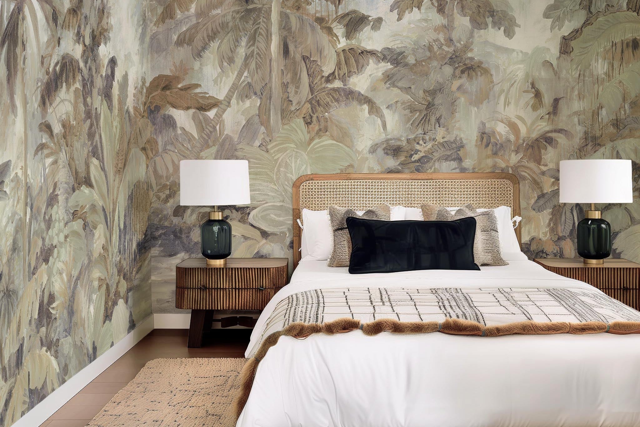 An interior bedroom featuring a panoramic matte wallpaper mural of a jungle scene in sepia and blue.