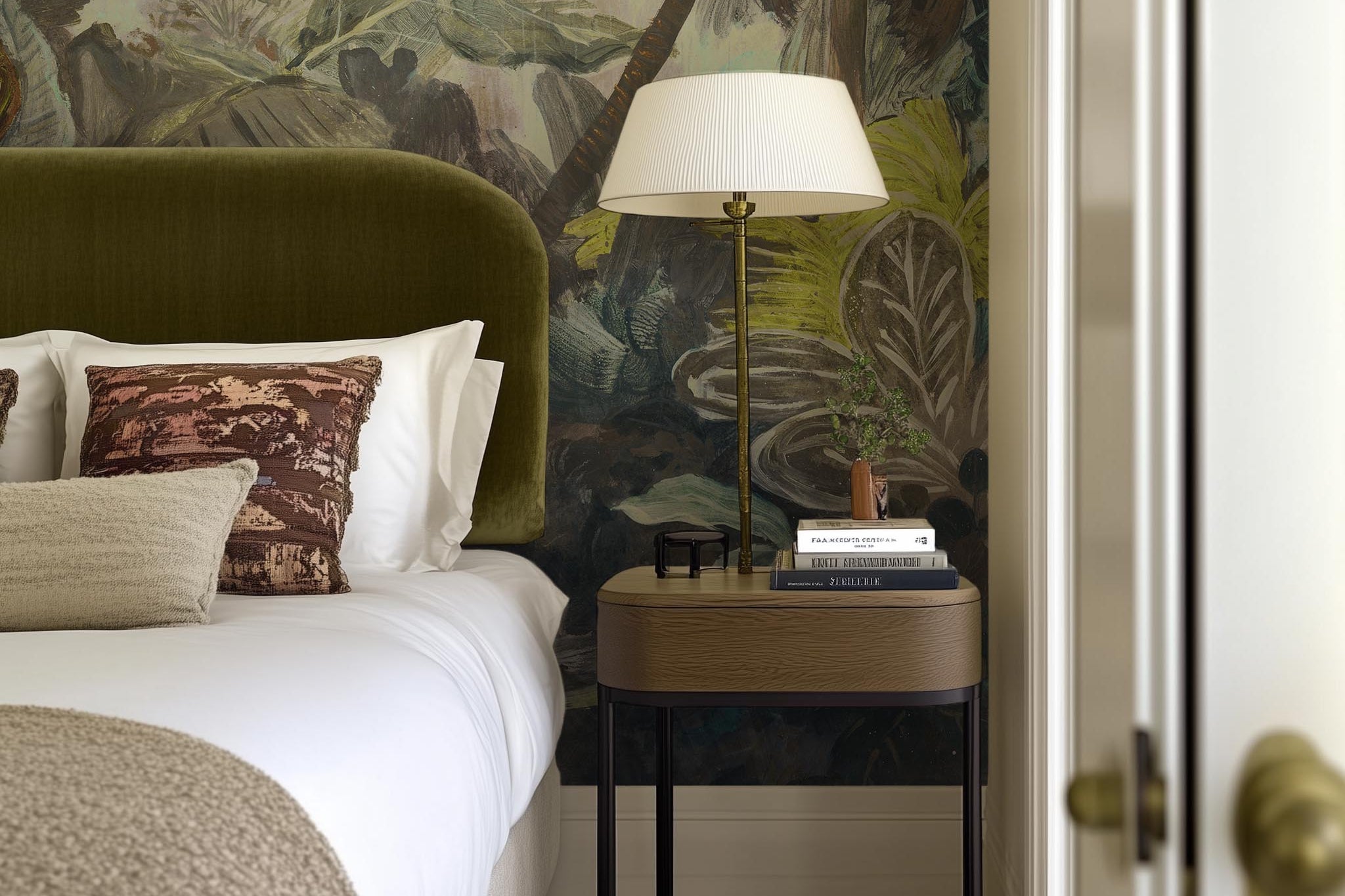 A cropped view of bedroom featuring a panoramic matte wallpaper mural of a moody jungle in teal and ochre.
