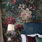 A cropped view of bedroom featuring a panoramic matte wallpaper mural of a floral bloom in crimson and blue.