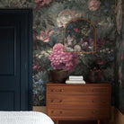 A cropped view of bedroom featuring a panoramic grasscloth wallpaper mural of a floral bloom in crimson and blue.