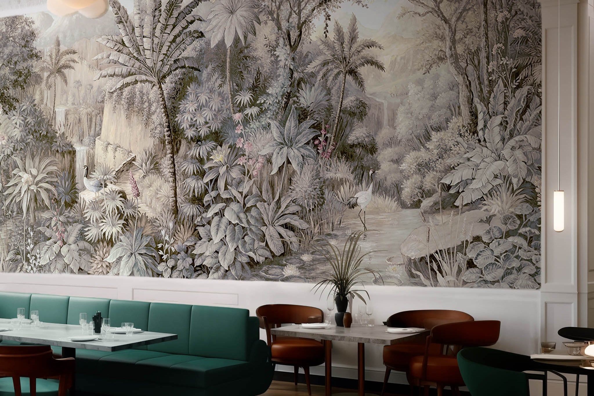 An interior restaurant featuring a panoramic matte wallpaper mural of a jungle vista in sepia and blush.