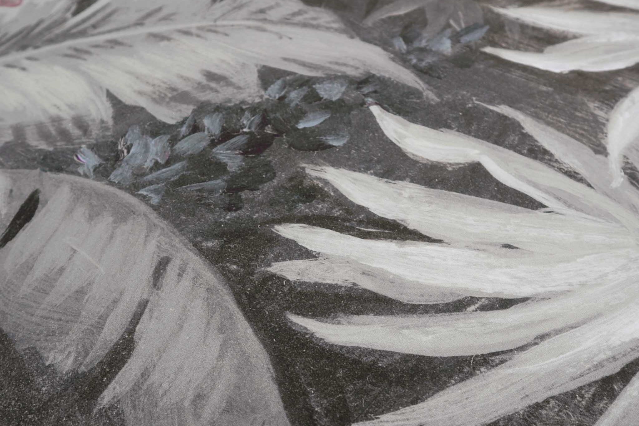 Close-up of a hand-painted, tropical-themed wallpaper mural featuring soft foliage in gentle ecru and grey tones.