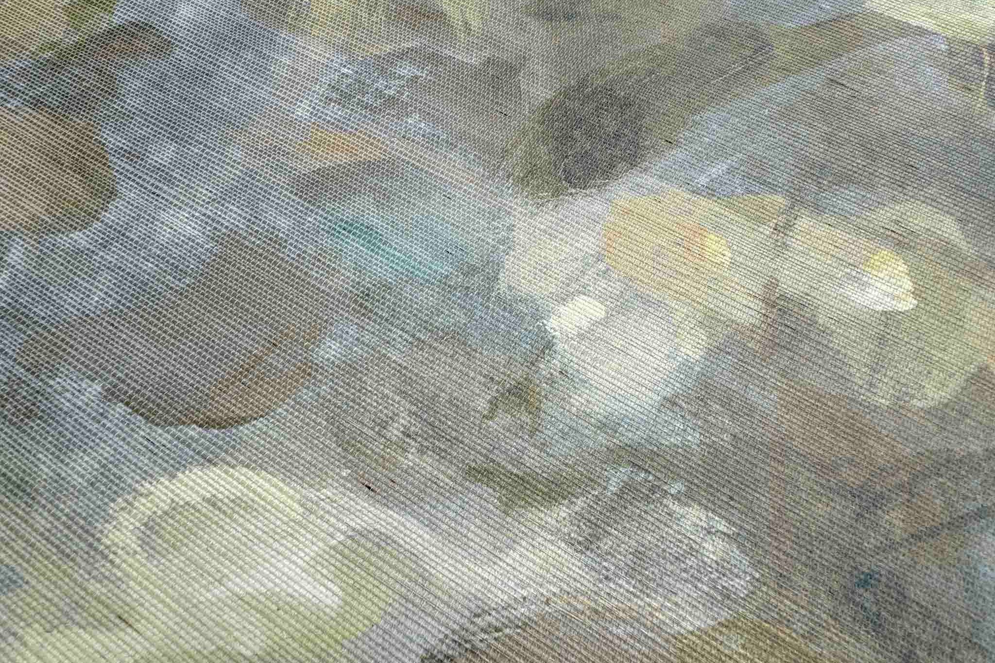 Close-up of a bespoke panoramic wallpaper mural featuring soft opal and lavender hues with a textured grasscloth finish.