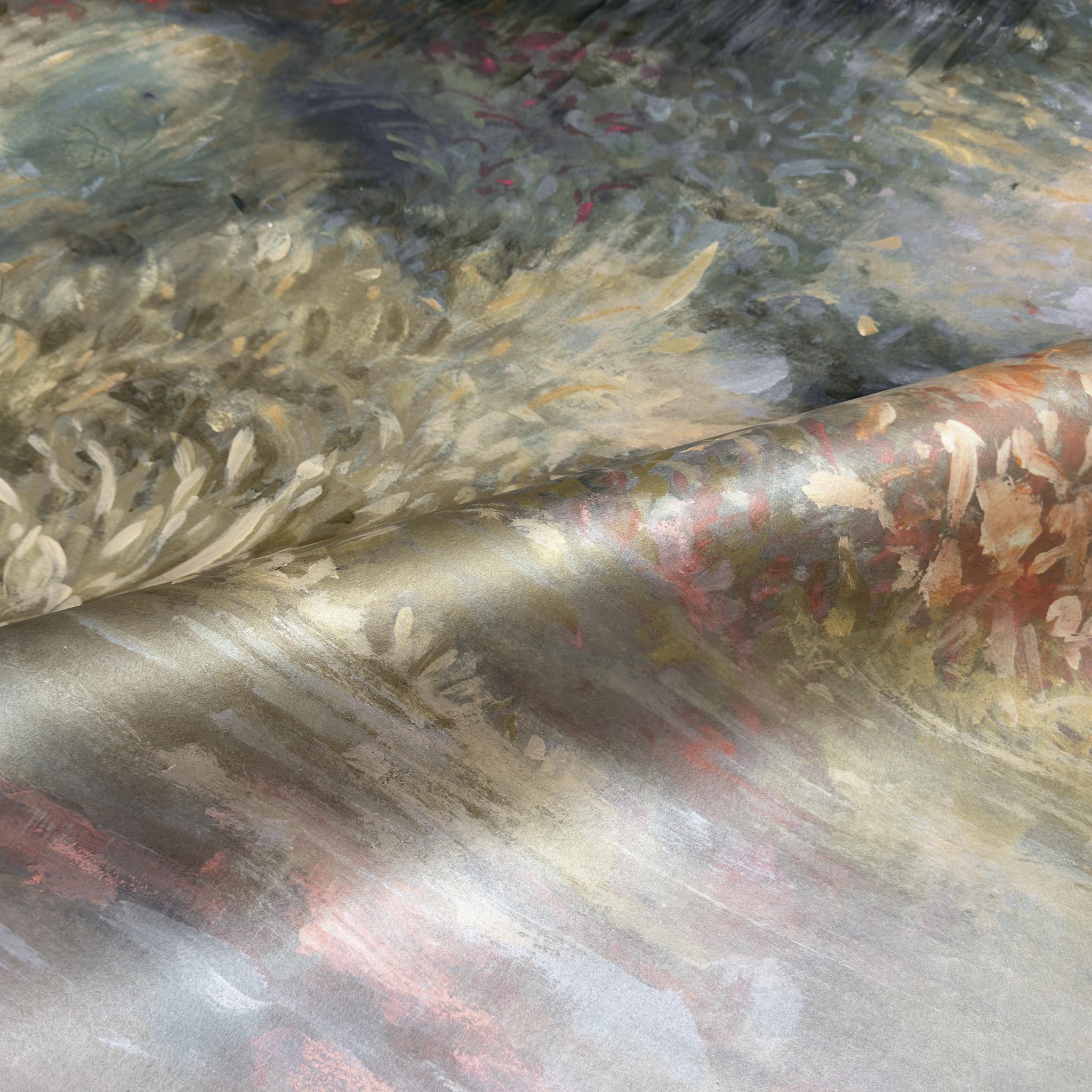 A close up view showing the detail of a pearlescent wallpaper mural which features softly shaded panoramic green mural.