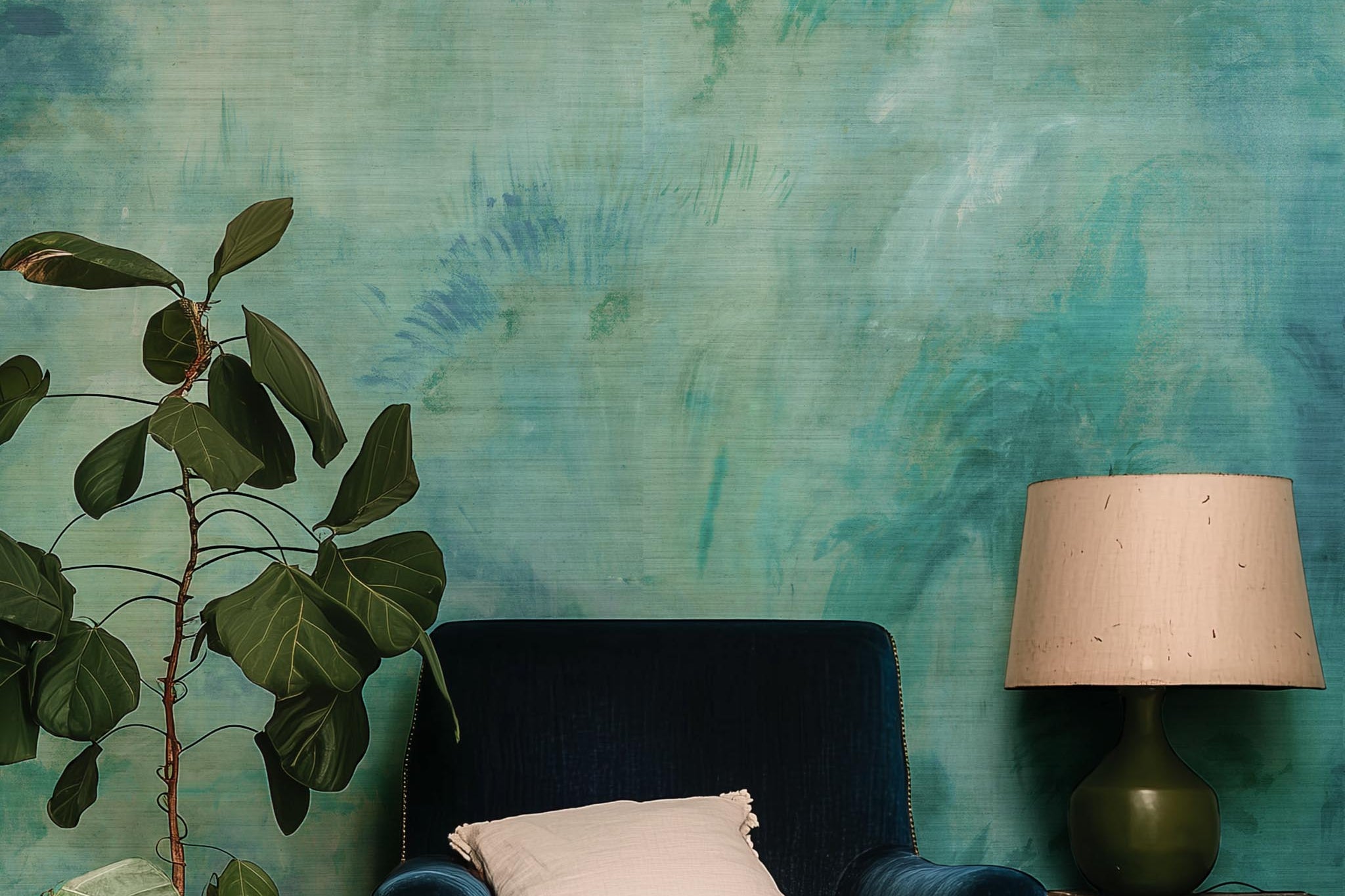 A cropped view of sitting area featuring a panoramic grasscloth wallpaper mural of an abstract wash in aqua and jade.