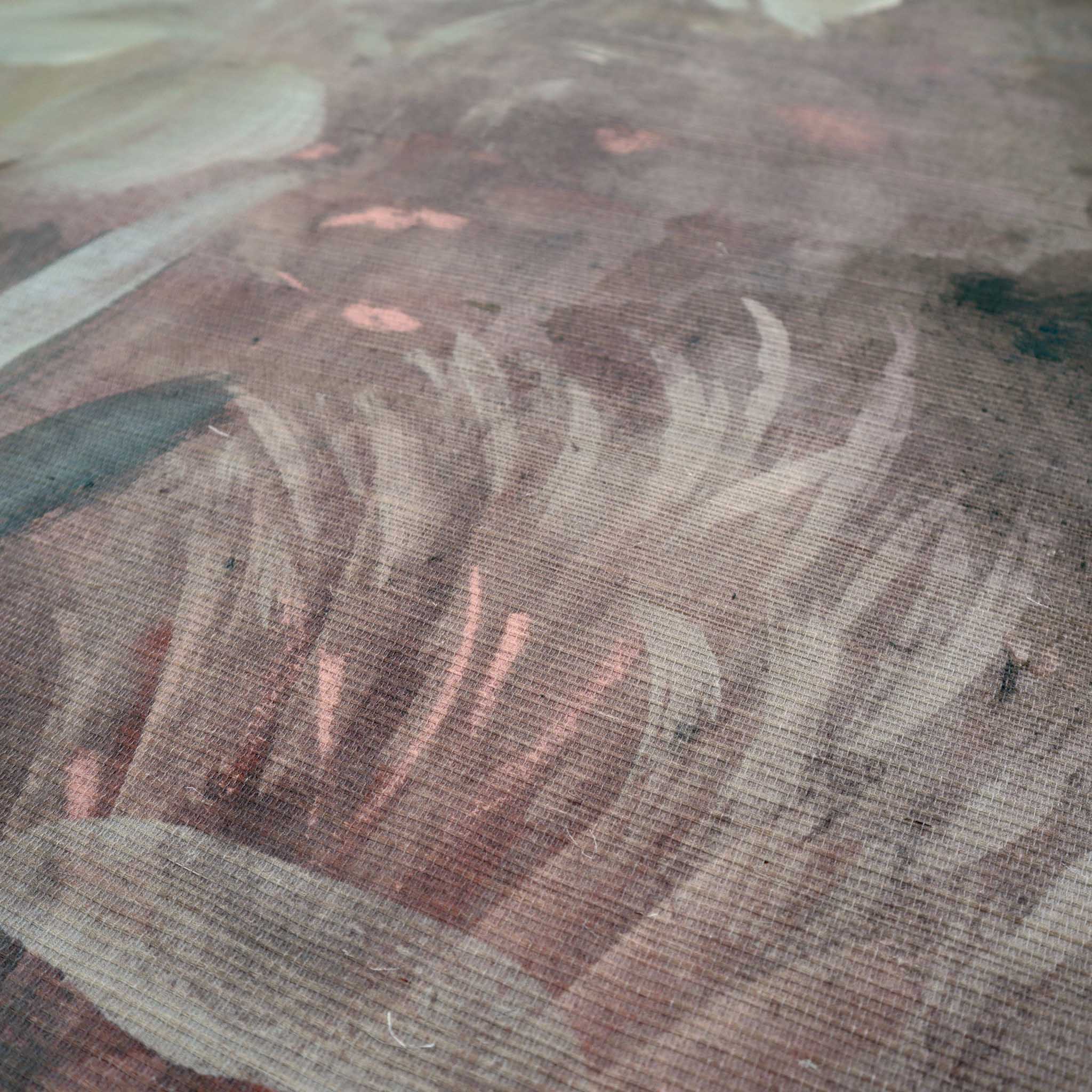 Close-up of a bespoke printed wallpaper mural featuring soft pastels and earthy tones finished on a grasscloth texture.