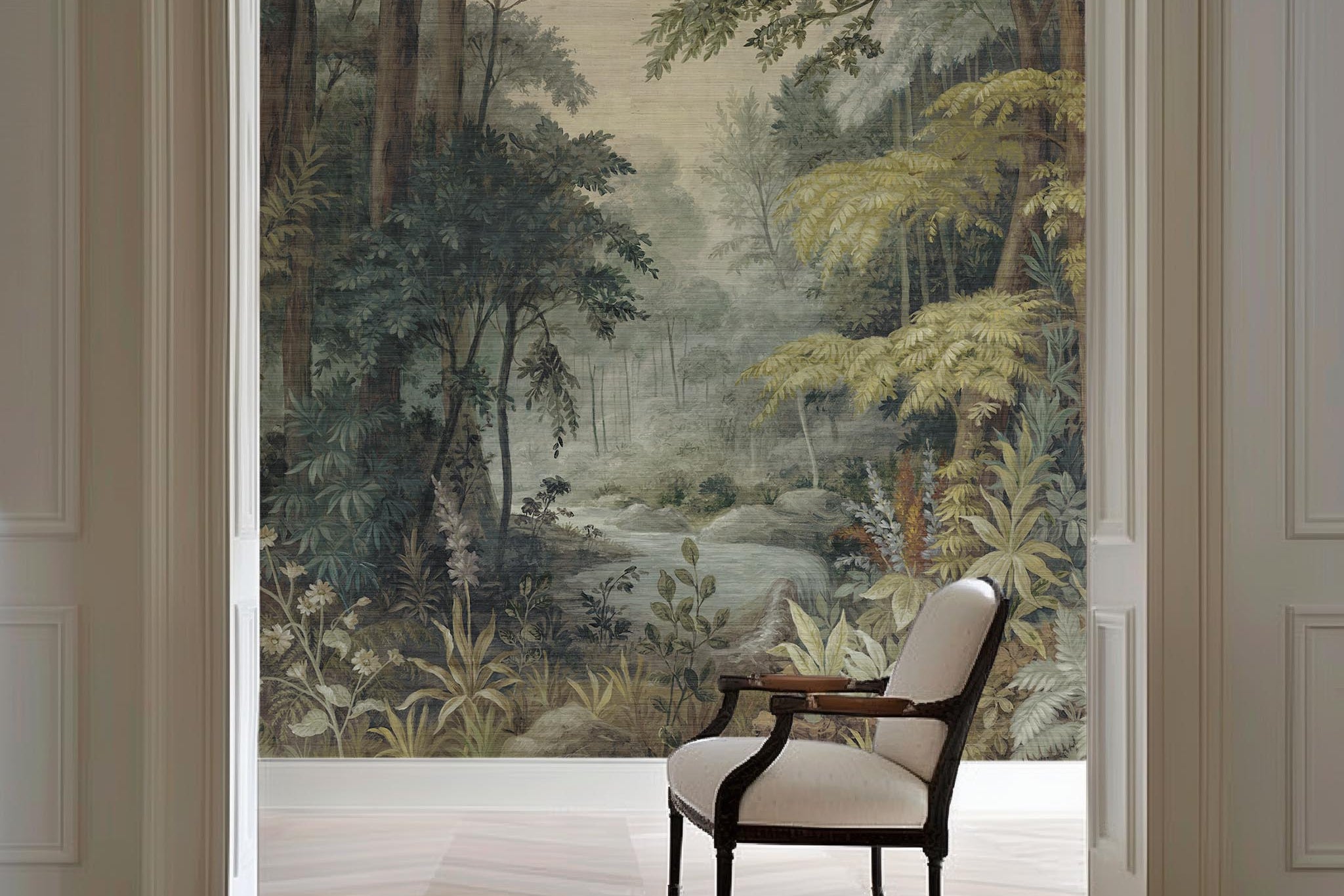 An interior sitting area featuring a panoramic grasscloth wallpaper mural of a misty woodland in sage and ochre.