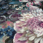 Close-up of textured grasscloth wallpaper mural featuring soft florals in deep jewel tones and soft blush hues