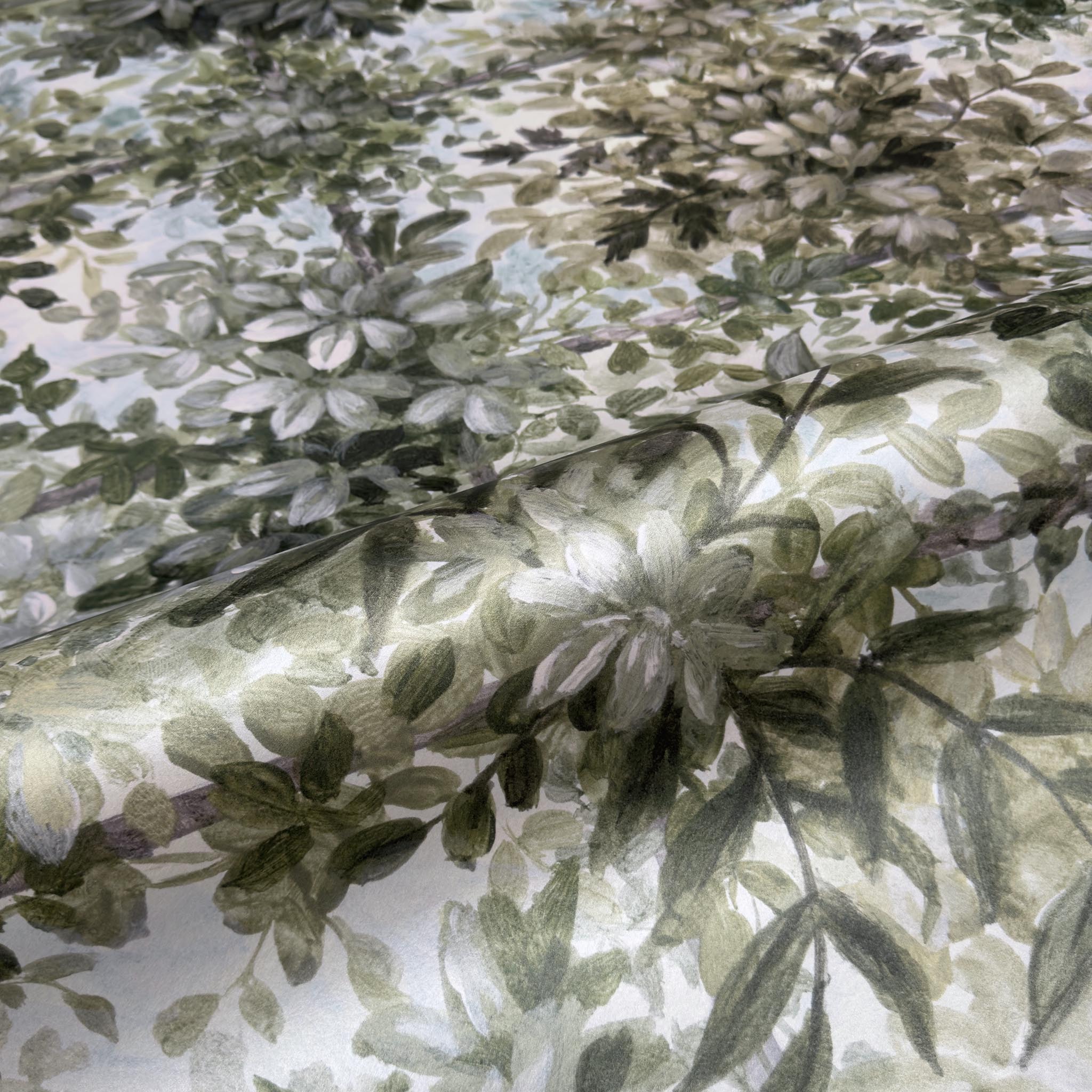 A close up view showing the detail of a pearlescent wallpaper mural which features calm mural in chamomile, sage, olive and cream tones.