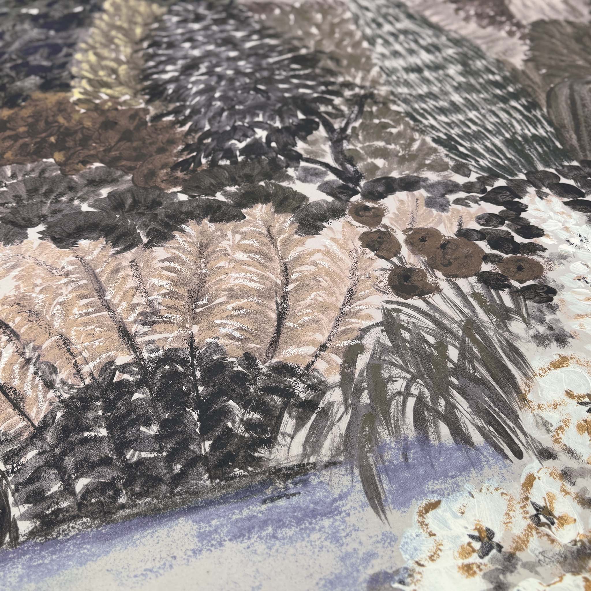 A close up view showing the detail of a matte wallpaper mural which features deep olive, slate, and ash tones