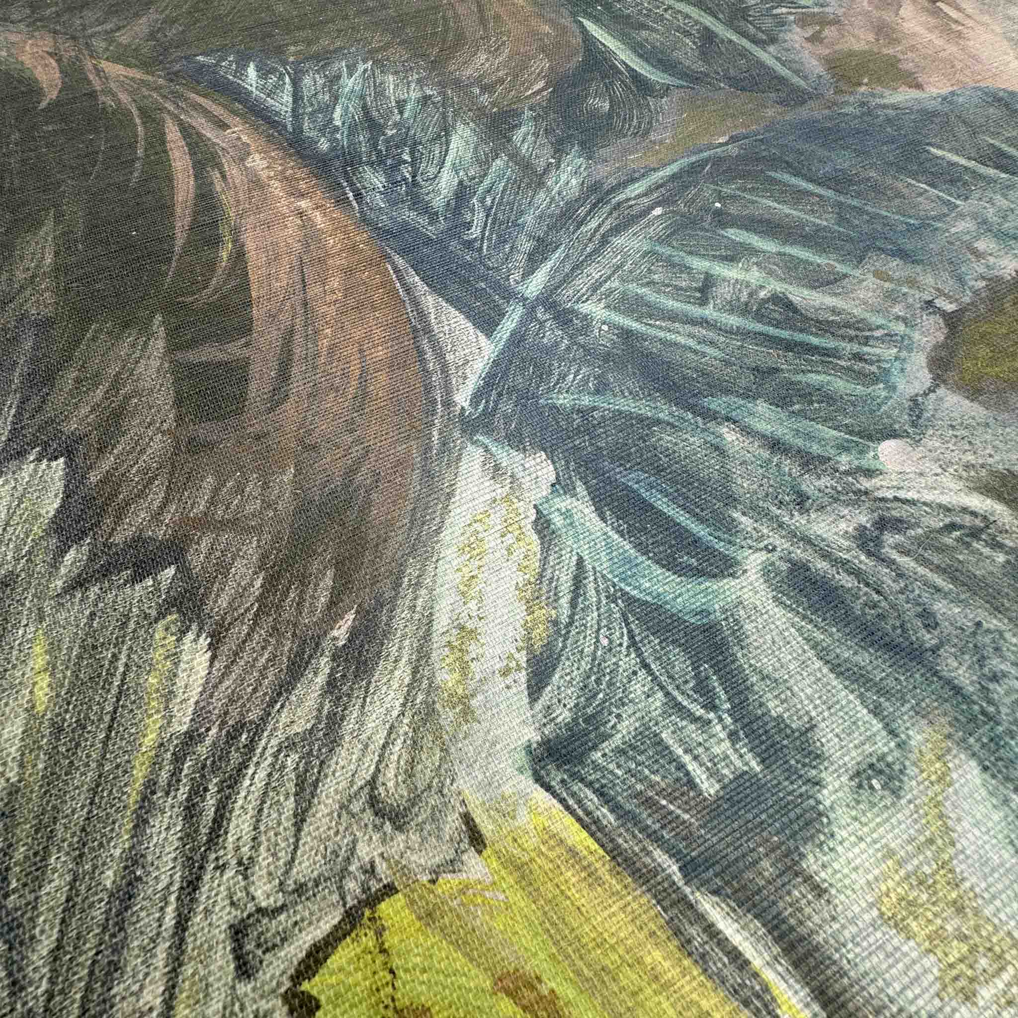 Close-up of a vibrant tropical landscape wallpaper mural on grasscloth, featuring rich greens, teals, and copper tones.