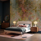 An interior bedroom featuring a panoramic matte wallpaper mural of a abstract layering of ochre and teal.
