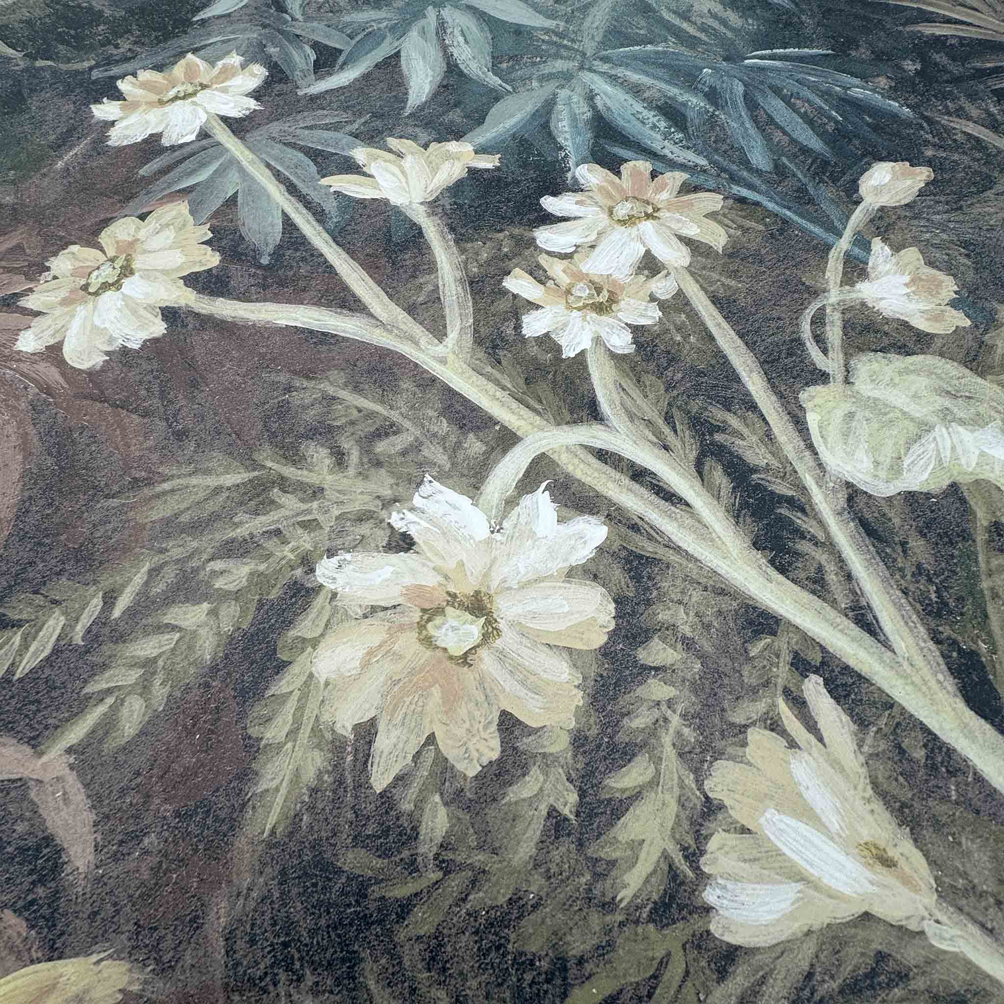 Close-up of a hand-painted floral mural featuring delicate white blooms and mossy greens on a matte uncoated substrate.