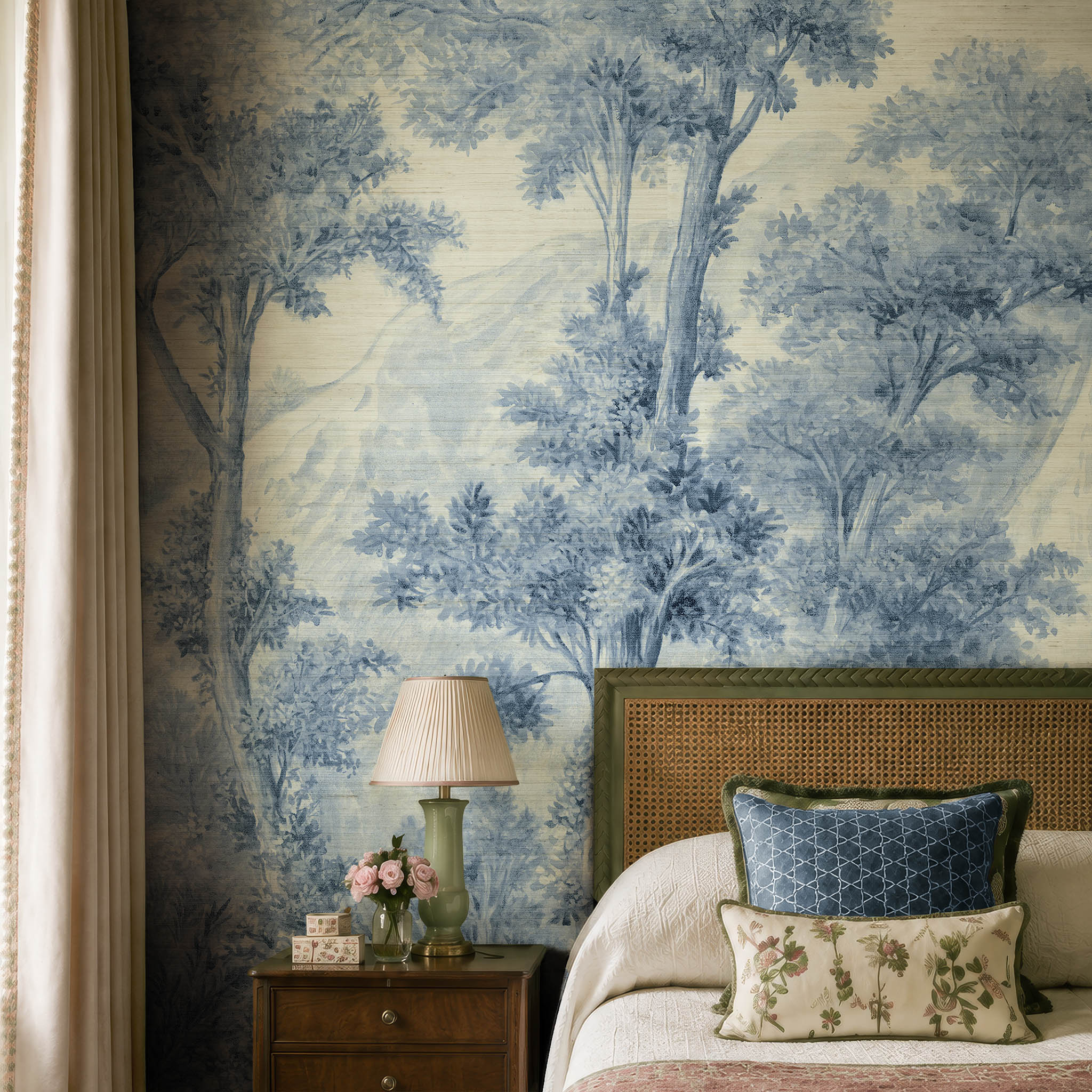 A cropped view of a bedroom featuring a panoramic grasscloth wallpaper mural of soft blue woodland