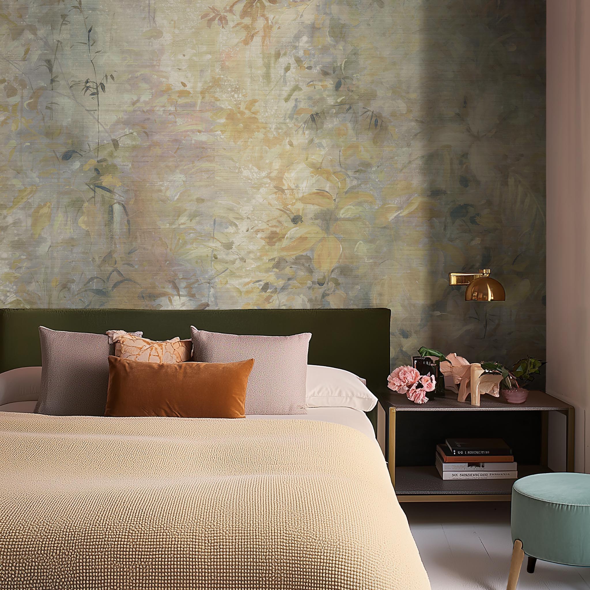 A cropped view of bedroom featuring a panoramic grasscloth wallpaper mural of an abstract forest in lemon and cream.