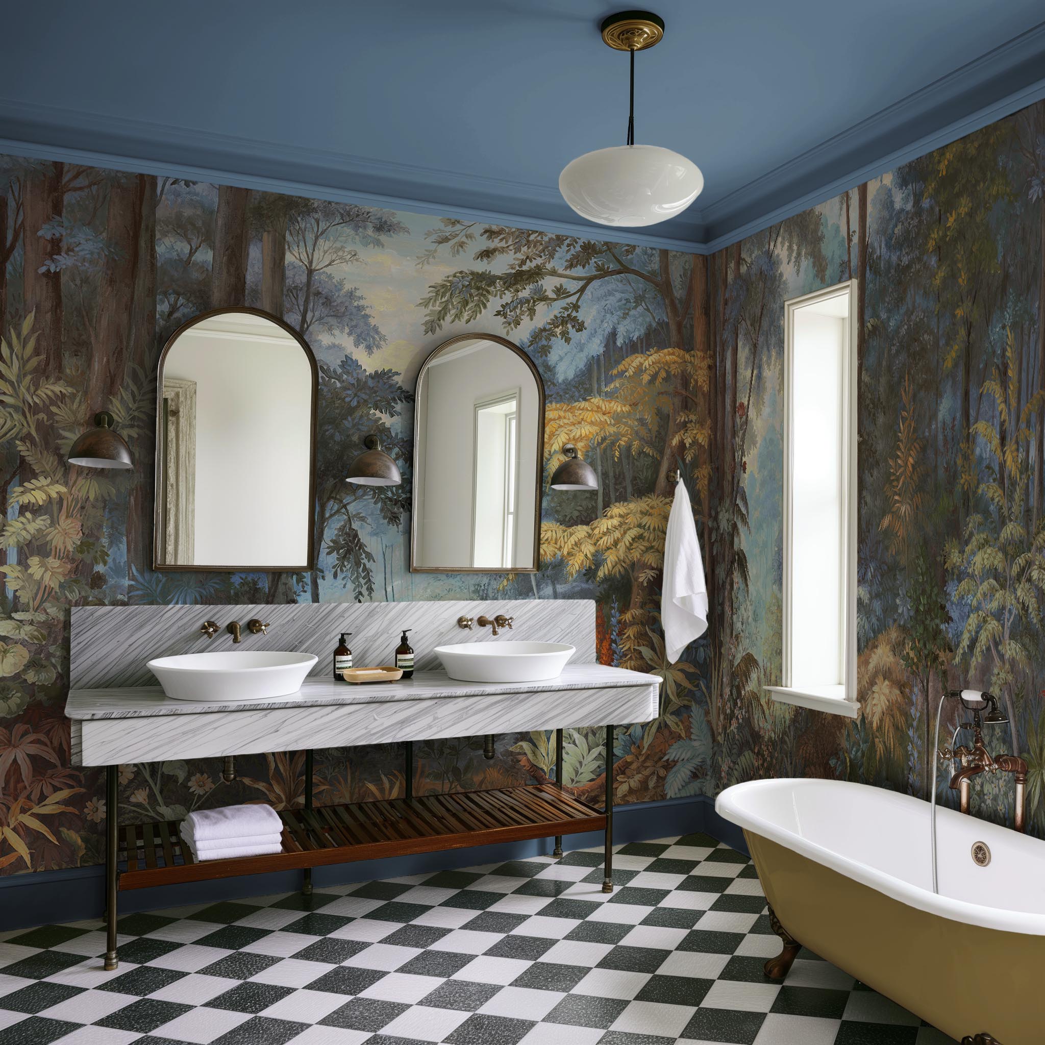 An interior bathroom featuring a panoramic vinyl wallpaper mural of an enchanted forest in blue and rust.