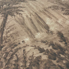 A close up view showing the detail of a matte wallpaper mural which features sepia-toned woodland
