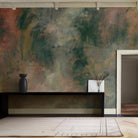 An interior living room featuring a panoramic vinyl wallpaper mural of an abstract haze in green and blush.