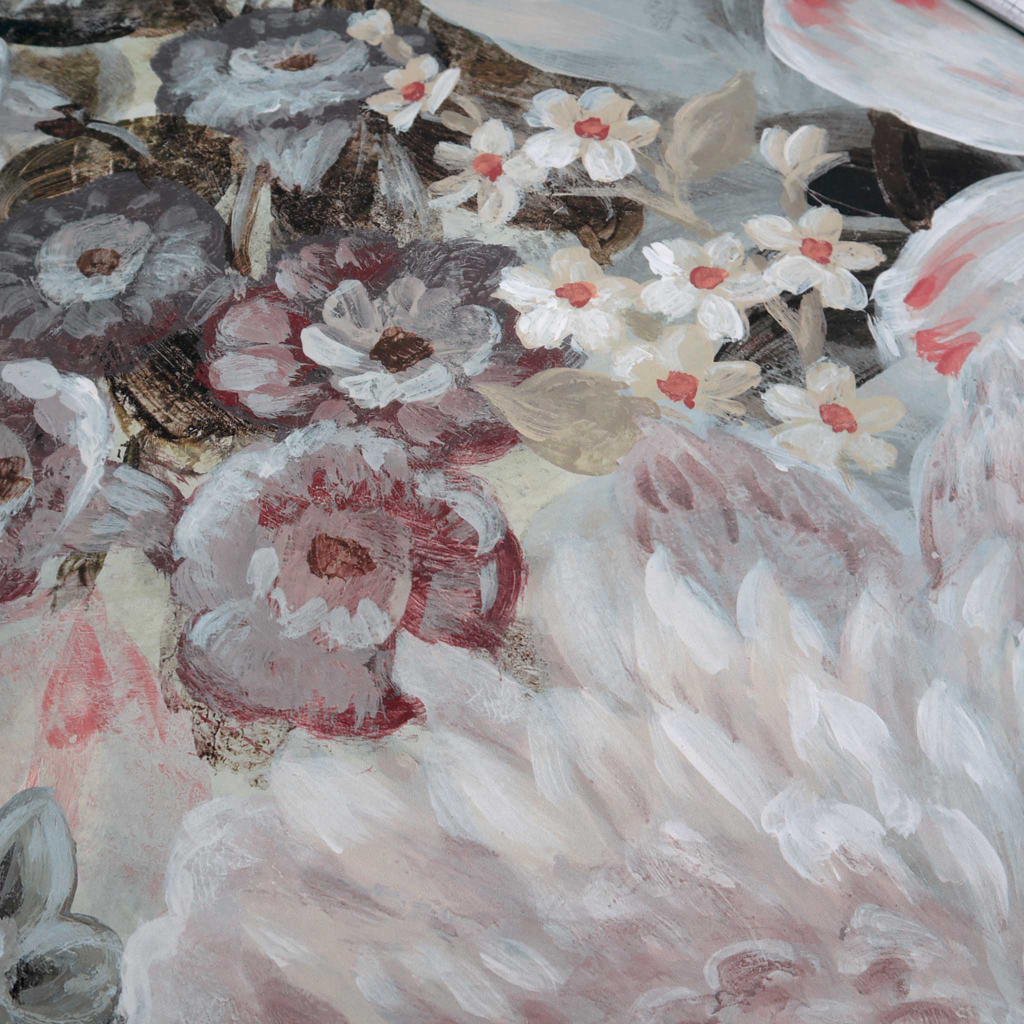 Close-up of a floral mural featuring soft blush pinks, creamy whites, and muted greens on a matte, smooth surface.