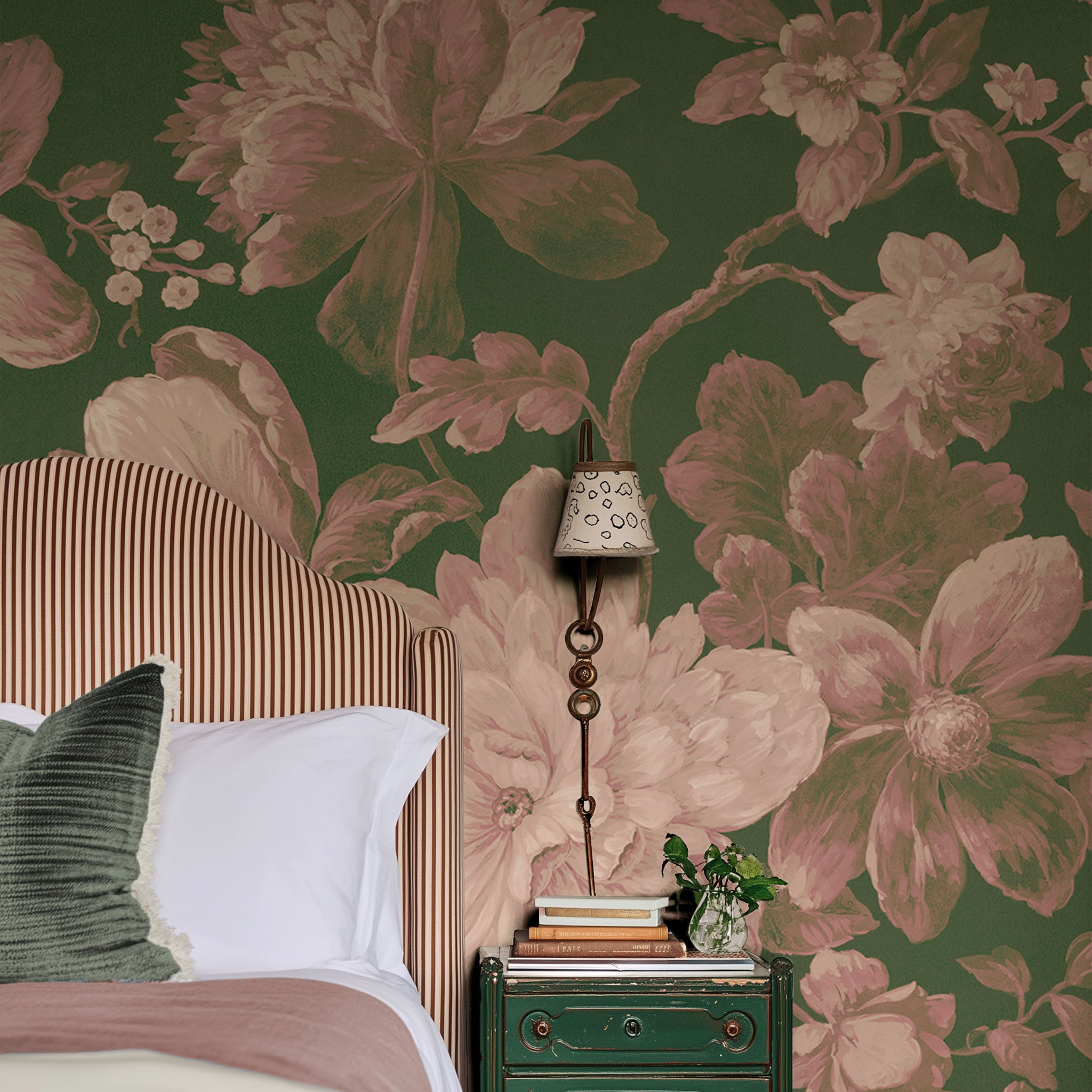 A cropped view of bedroom featuring a panoramic matte wallpaper mural of rosy florals on lush green