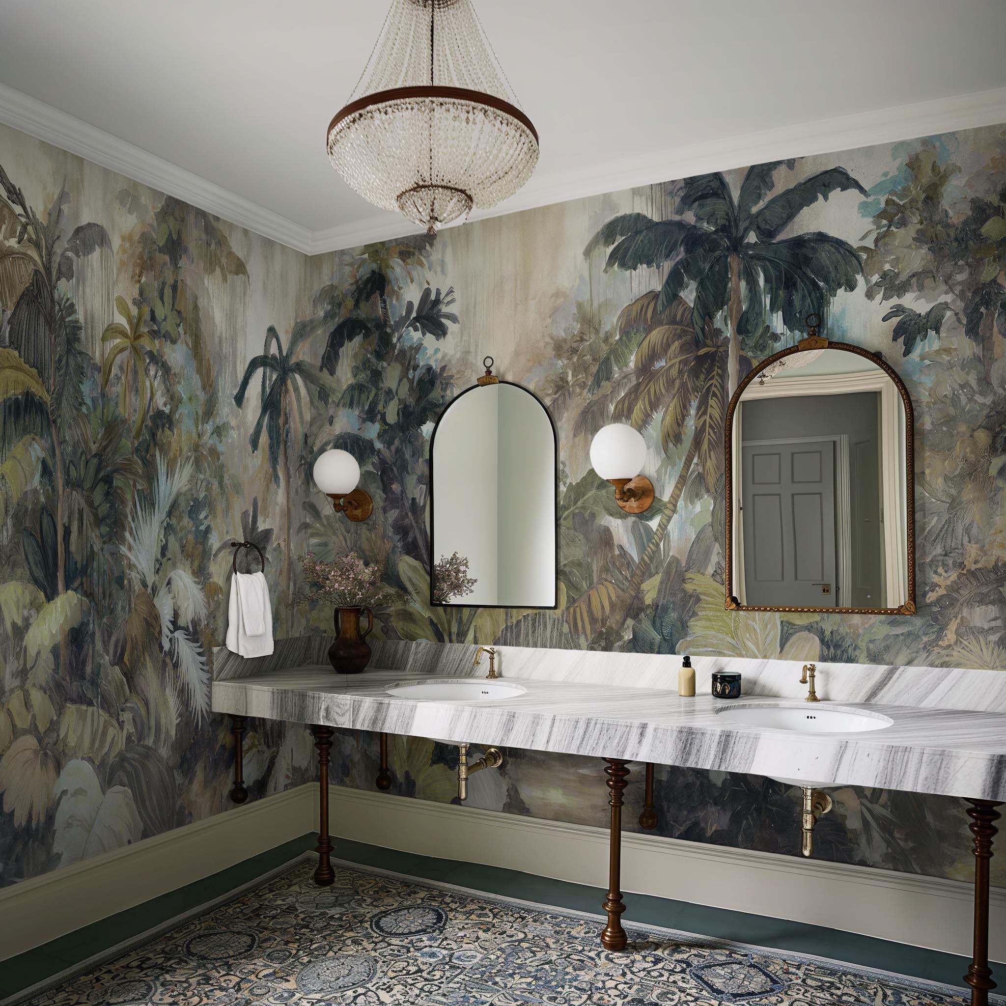 An interior bathroom featuring a panoramic vinyl wallpaper mural of a tropical scene in sage and parchment.