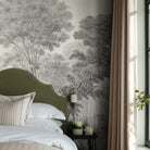 A cropped view of bedroom featuring a panoramic matte wallpaper mural of ash grey forest