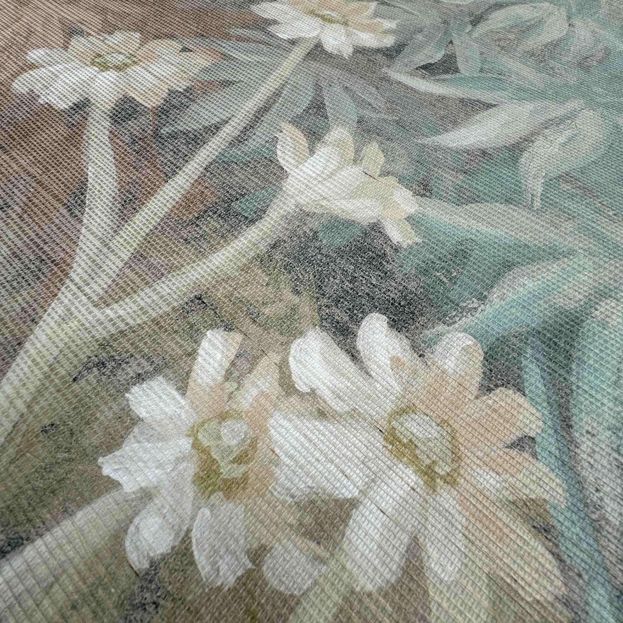 Close-up of a bespoke printed wallpaper mural on grasscloth, featuring soft celadon greens and delicate floral details.