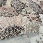 A close up view showing the detail of a matte wallpaper mural which features almond, dusty rose, and misty tones