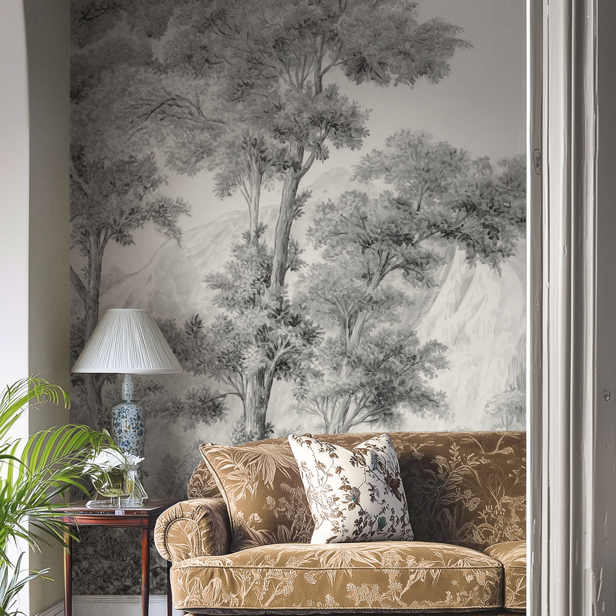An interiorliving room featuring a panoramic matte wallpaper mural of ash grey forest