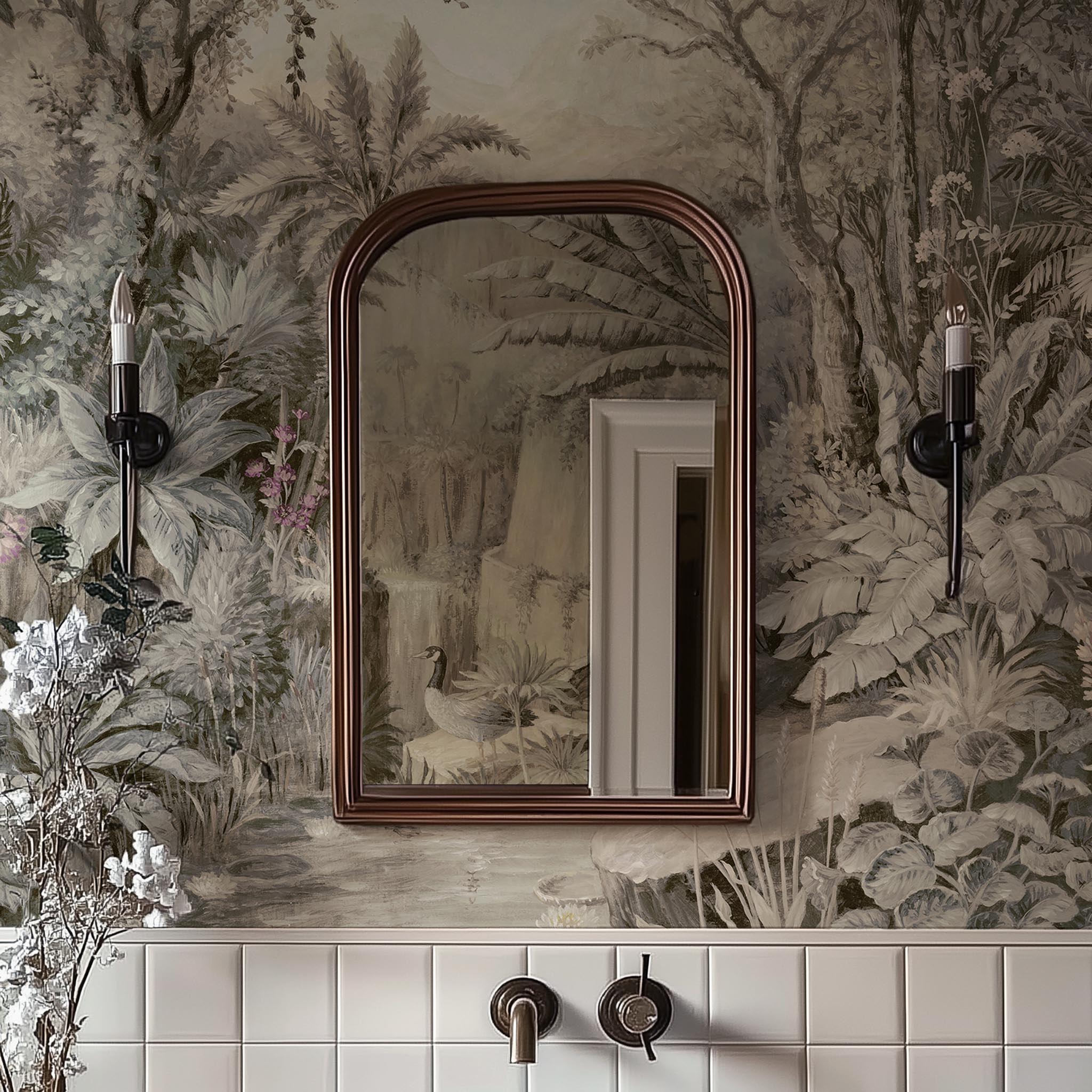 A cropped view of bathroom featuring a panoramic vinyl wallpaper mural of a jungle vista in sepia and blush.