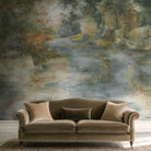 A cropped view of a living room featuring a panoramic pearlescent wallpaper mural of softly shaded panoramic green mural.