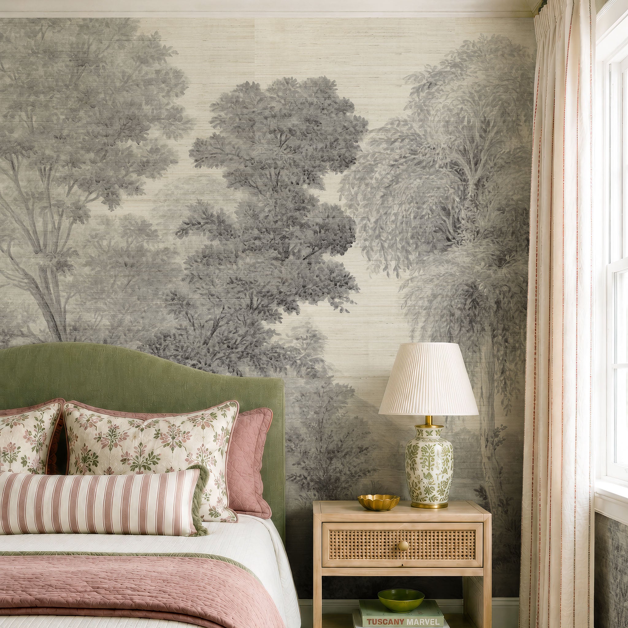 A cropped view of a bedroom featuring a panoramic grasscloth wallpaper mural of ash grey forest