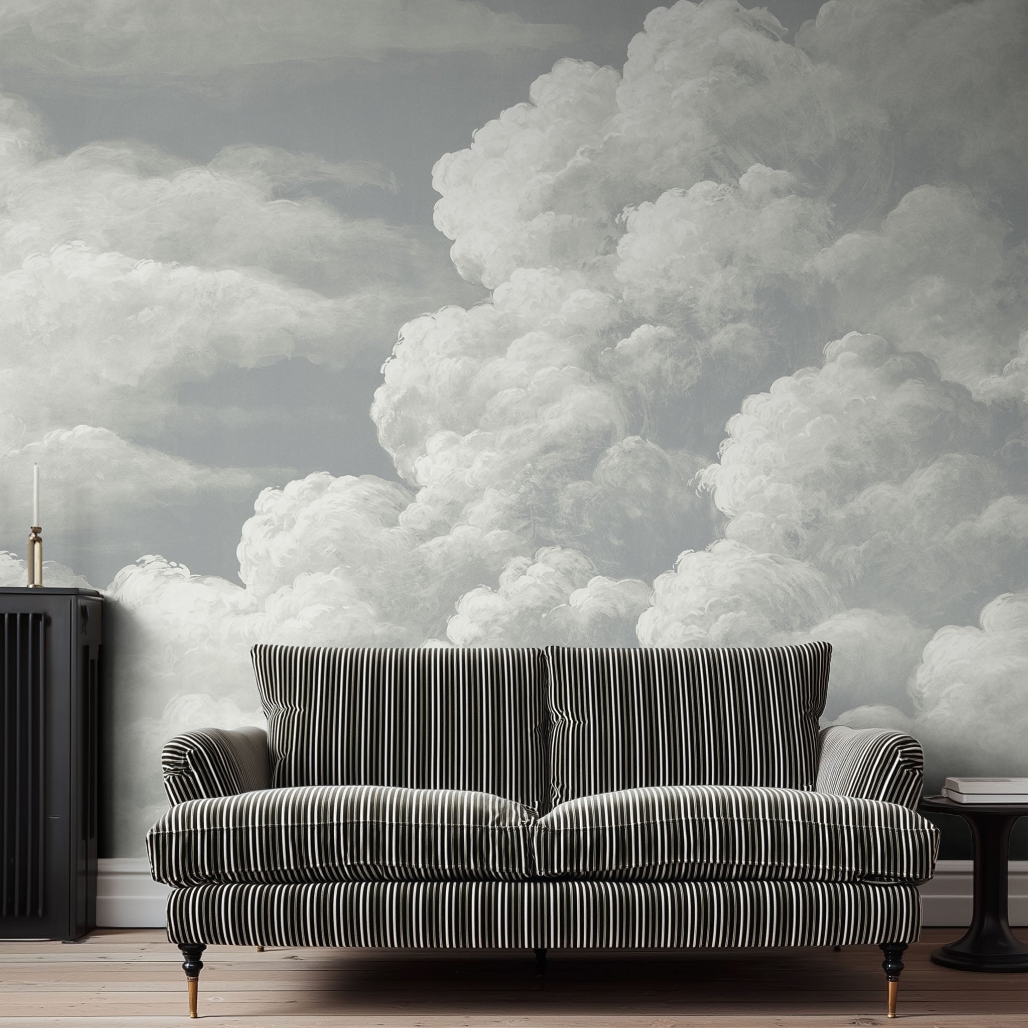 A cropped view of sitting area featuring a panoramic matte wallpaper mural of pale sculpted clouds