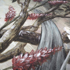 Close-up of a vintage-inspired chinoiserie mural featuring floral elements in soft greys, warm peach and muted blues.