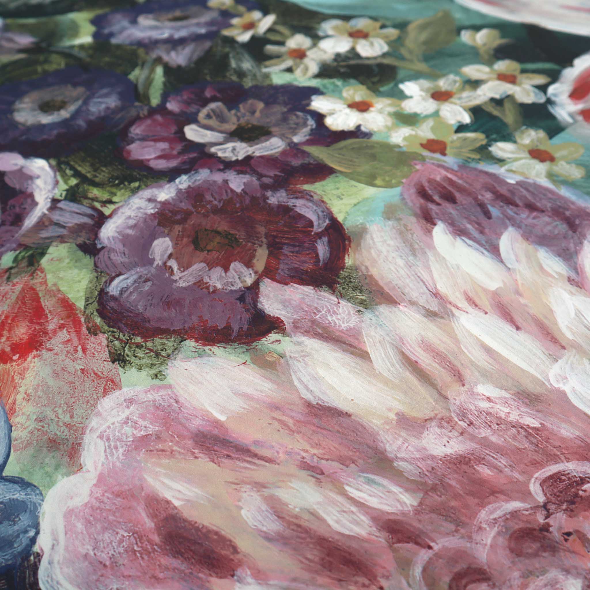 Close-up of a vibrant floral mural featuring rich greens, reds, purples, and soft pinks on a matte non-woven substrate.